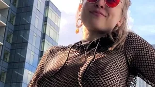 Blonde is flashing her big boobs in the outdoors