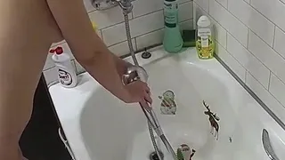 Pink labia close up of naive brunette playing with her name