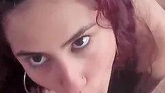 Close up video of a redhead chick giving her man a blowjob