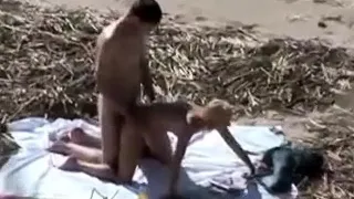 A Voyeur Films A Couple On Beach
