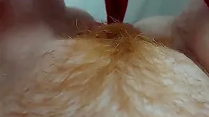 Close up video of a horny redhead fingering her hairy pussy