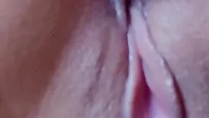 Close up video of a solo chick pleasuring her shaved pussy