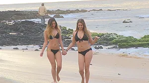 Topless chicks Nicole and Veronica have lots of fun on the beach