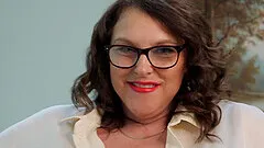 Good looking babe Carol Brown gets naked and sucks a dildo