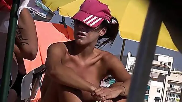 Voyeur films sexy topless ladies at the beach