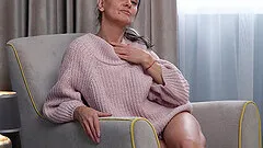 Gerda Ice enjoys fingering her dripping love tube on the sofa