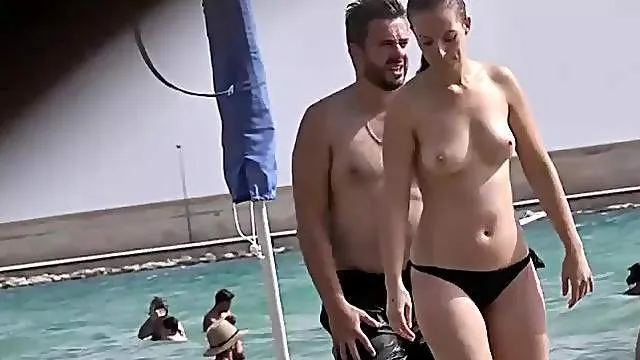 Nice ass and perky breasts on a babe chilling at the beach