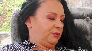 Sexy brunette BBW Remi masturbates with a toy on the sofa