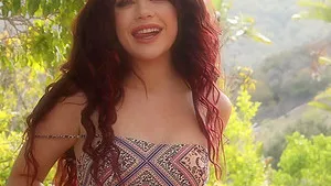 Redhead cutie Sabina Rouge strips down and shows her pussy