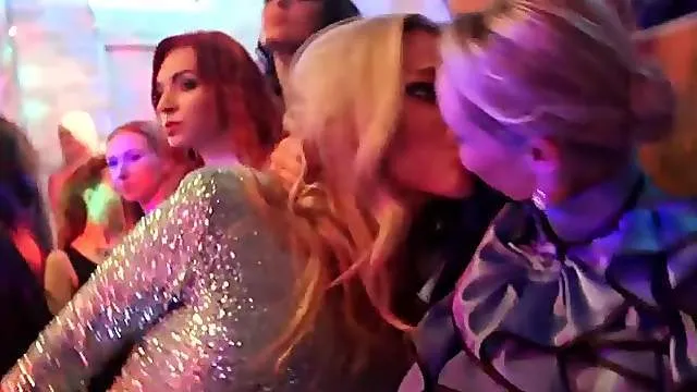 Well dressed beauties blow guys at a night club