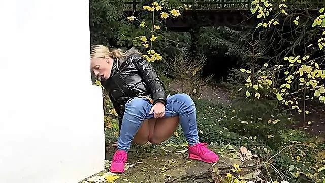 Beauty in a shiny coat goes pee in a public place