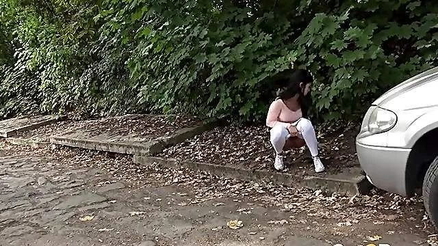 Hot young girl goes pee on a public path