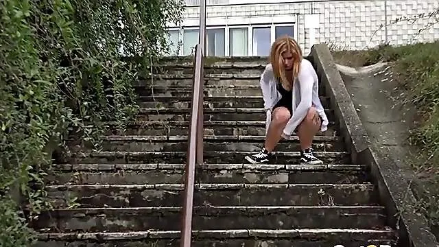 Beautiful girl pisses in public as a runner goes by