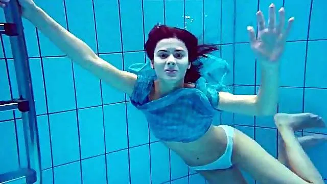 Underwater erotica stars a sexy swimming girl