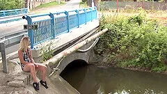 Blonde Nina enjoys while giving her boyfriend a handjob in public