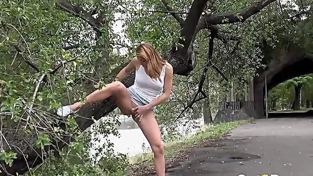 Busty hottie takes a quick piss on the street