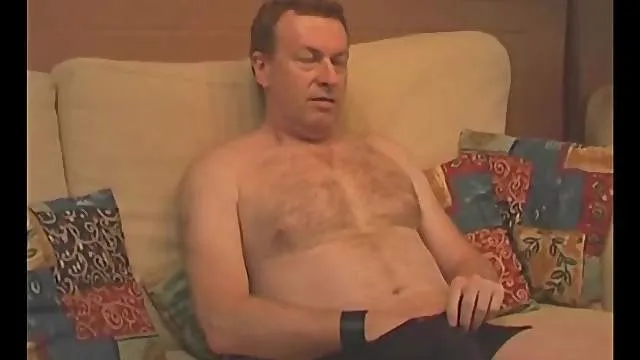 Thick mature guy jerks off while watching porn