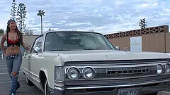 Bridgette B enjoys while her puss is being licked in the car