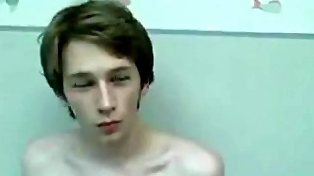 Teen in jeans strips and strokes his dick to orgasm