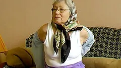 Solo grandma stripping down and playing her pusssy really well with sex toy