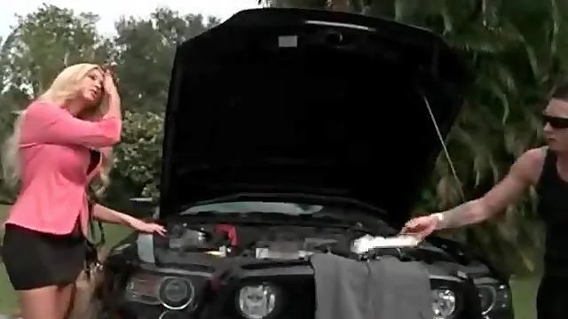 Mechanic works the car and those big bimbo tits