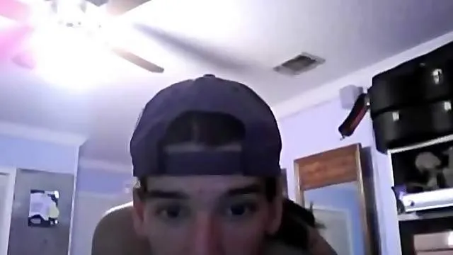 Boyfriend in ball cap fucks lover in the butt