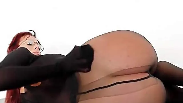 Sexy redhead rips her nylons to fuck a toy