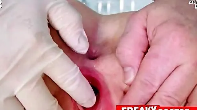 Gynecologist up close with his teen patient