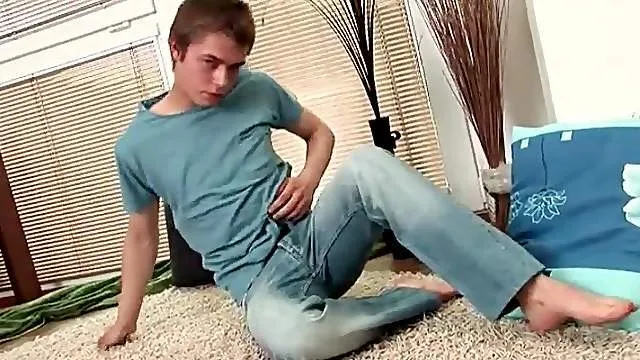 Cute stripping boy with a shaved chest