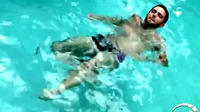 Swimming in the pool and masturbating his dick