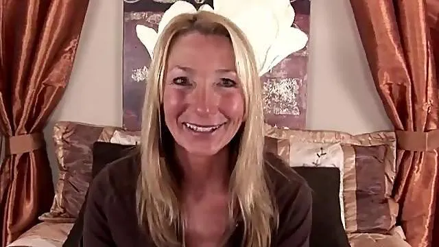 Old lady Pam Roberts in a sexy striptease video