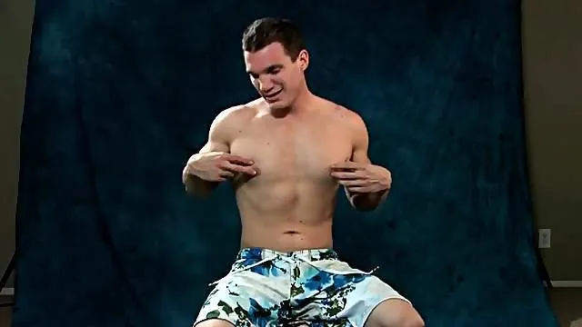 Cute guy strips off swimsuit and strokes dick