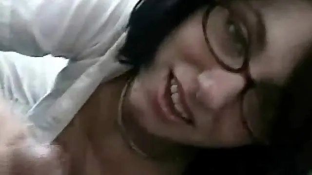 Amateur in nerdy glasses gives handjob