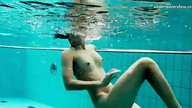 Talented swimmer is naked underwater