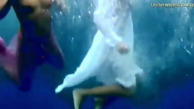 Three ladies get naked swimming in the ocean