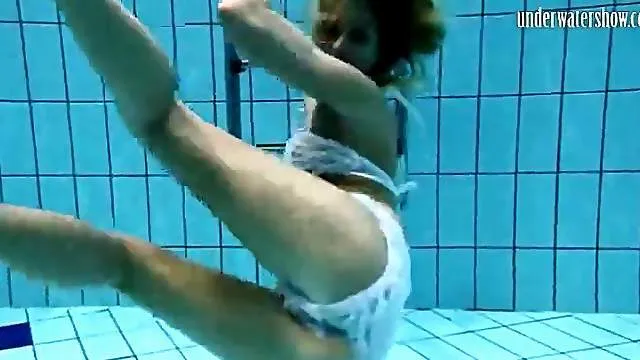 Skinny girl goes swimming in white lingerie