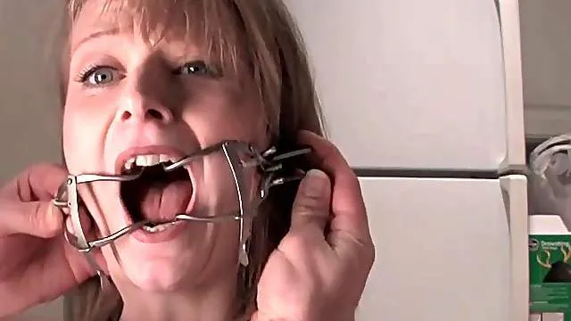 Her own piss flows into her mouth