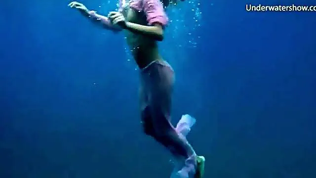 Half naked girls swim in the ocean