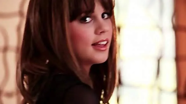 Busty beauty in lace lingerie fondles her tits