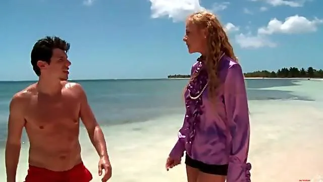 Slut in purple satin blouse sucks cock on the beach