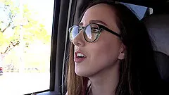 Brunette girl Charlie Stevens gets talked into sucking a cock in a car
