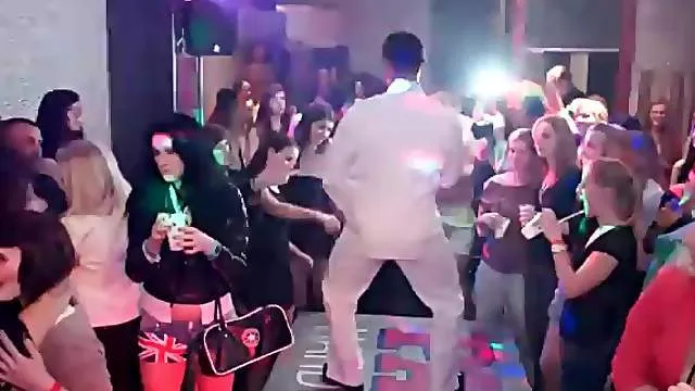 Girls fool around with the dancing guys at club