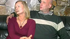 Two naughty chicks love playing with a hard cock on the couch