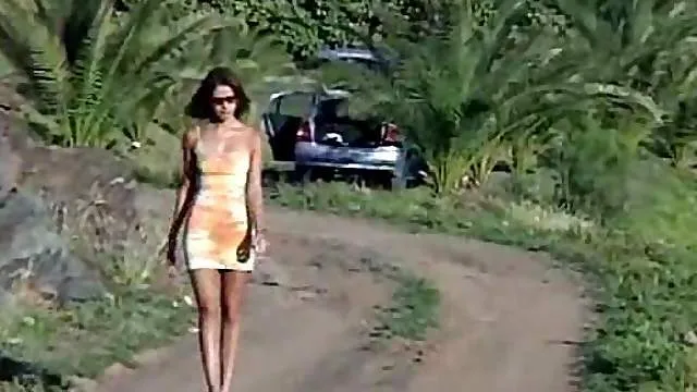 Slim girl in tight dress pisses outdoors