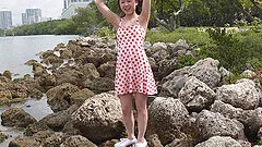 Handsome brunette Lulu takes off her dress to show her naked body