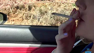 Amateur video of stranger Lily Adams smoking a cigar in the car