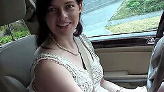 Pretty brunette masturbates in the car during driving