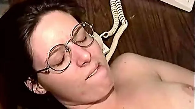 Nerdy secretary on her desk taking a bone