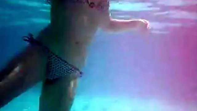 He masturbates under water in public pool