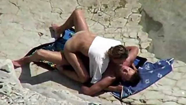 On top of his cock at the beach